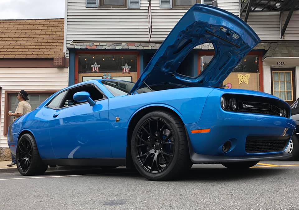B5 Blue Challenger displayed at a Main Street car show